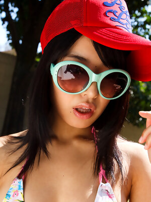 Kana Yume Asian shows nude playful tits and hairy cunt in nature