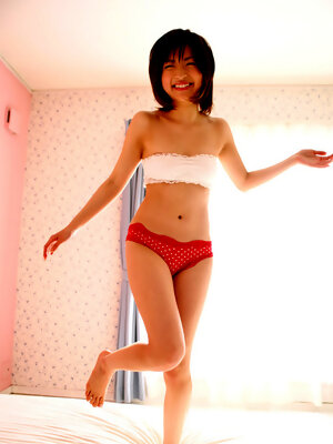 Ryoko Tanaka Asian exposes hot behind in red panty in her bed