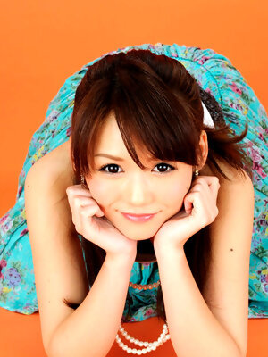 Yumi Asian honey on heels and with big eyes is elegant and sexy